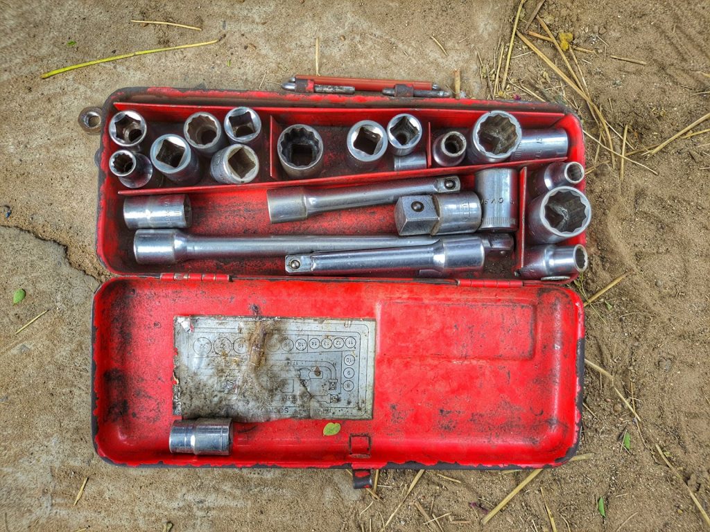 A red toolbox with tools in it