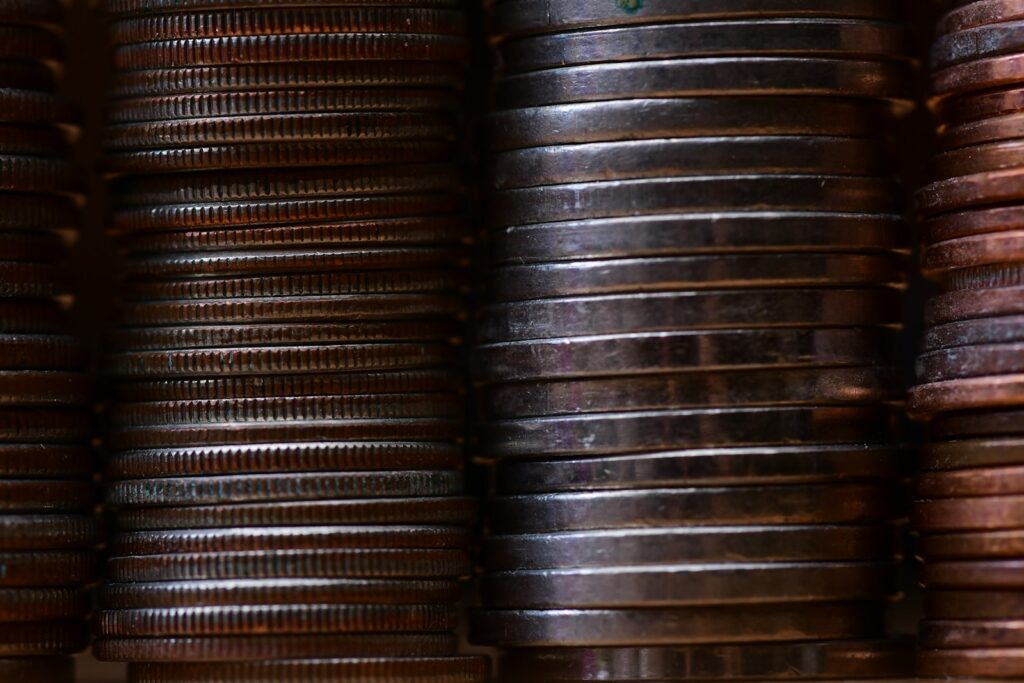 round gold-colored coin lot pile